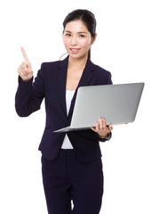 Businesswoman use of laptop and finger point up