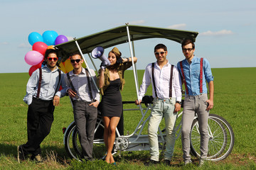 woman leading 4 guys on a quad bike