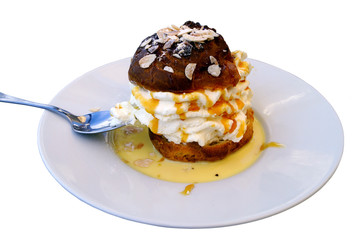 Isolated cream puff with whipped cream
