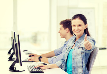 two smiling students in computer class
