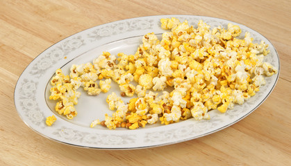 Partially eaten platter of popcorn