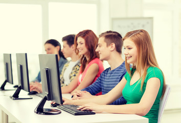 female student with classmates in computer class