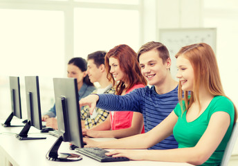female student with classmates in computer class