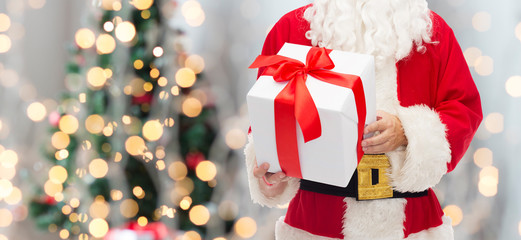 man in costume of santa claus with gift box