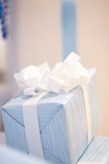 blue box with a white bow for Christmas