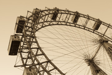 Old ferris wheel in Prater park in Vienna, sepia - obrazy, fototapety, plakaty