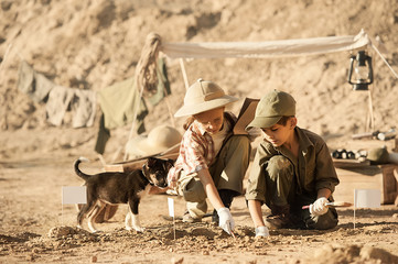Children conduct archeological excavations