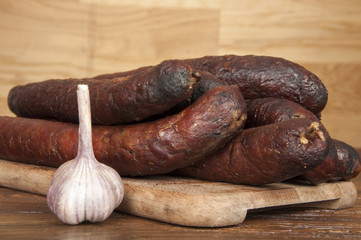 kind of sausage - wooden background