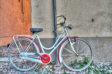 red and white bike against the wall