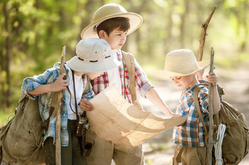 Boys travelers exploring route map