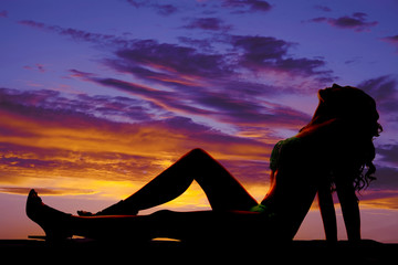 silhouette of woman fringe bikini lay back