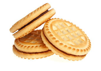 Sandwich biscuits with chocolate filling on a white background