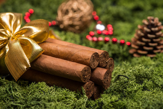 Cuban cigars Christmas gift with golden ribbon and ornaments