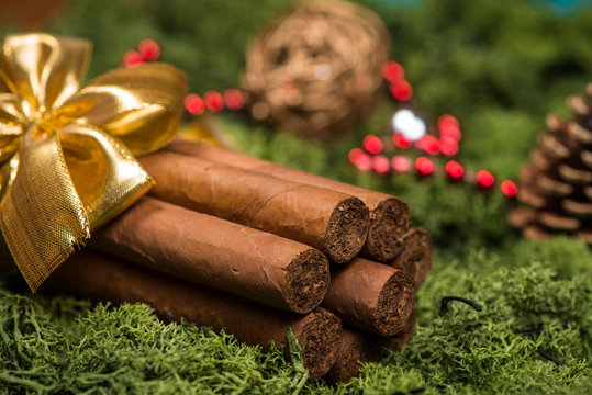 Cuban cigars Christmas gift with golden ribbon and ornaments