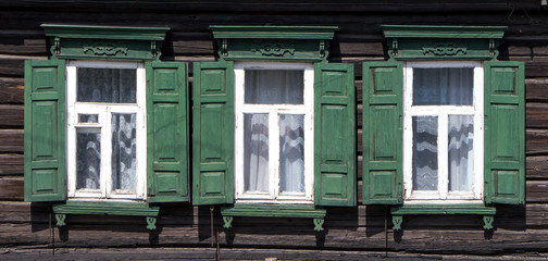 Wooden window with shutter doors.