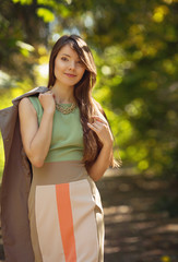 beautiful young woman with makeup in fashion clothes