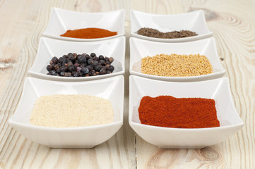 various spices on wooden table