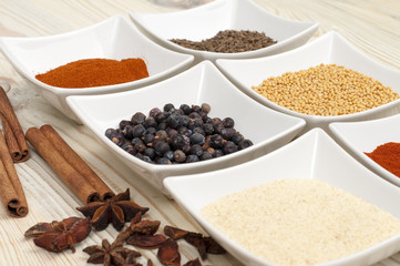 various spices on wooden table