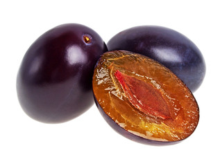 Two fresh plums on a white background
