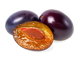 Fresh plums on a white background