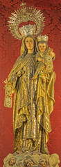 Fototapeta na wymiar Seville - carved polychrome statue of Madonna in San Roque