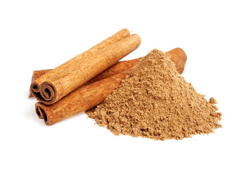 Cinnamon sticks and powder on white background