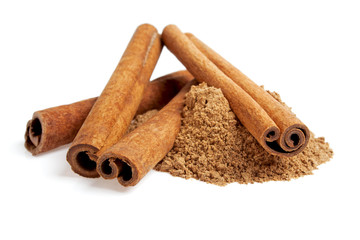 Cinnamon sticks and powder on white background
