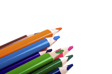 Colored pencils on white background