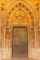 Seville -  The Nativity scene on the side portal of Cathedral