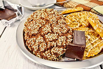 Cookies chocolate and shortbread with sesame on metal tray