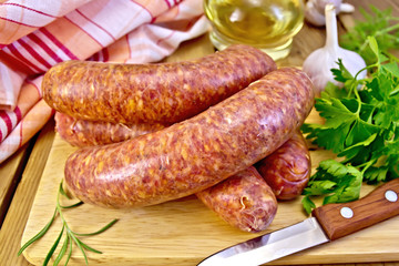 Sausages beef on board with knife