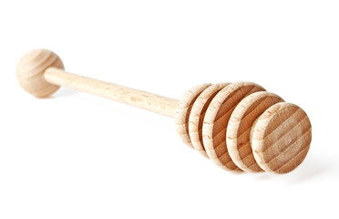 Wooden spoon for honey isolated on a white background
