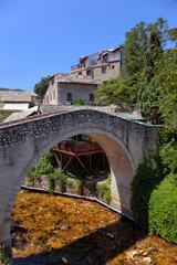 Fototapeta na wymiar Typical old stone bridge in Mostar, Bosnia and Herzegovina.