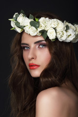 Sensuality. Young Brunette wearing Wreath of Roses