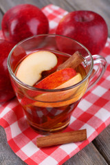 Apple cider with cinnamon sticks and fresh apples