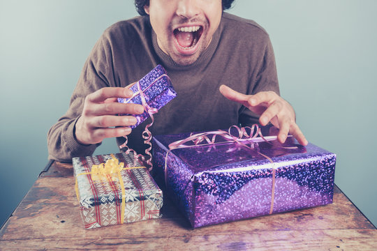Young man excited about his presents