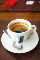 Cup of tasty coffee in cafe