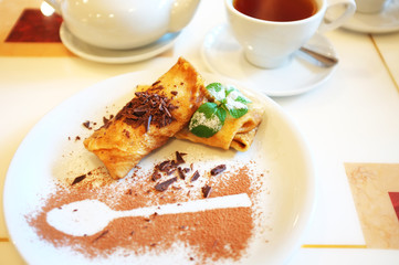 Tasty pancakes on plate in cafe