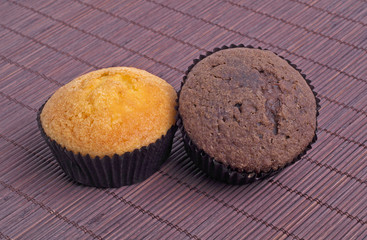 Muffins on a dark background of bamboo