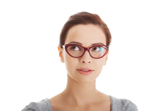 Portrait of a woman in eyewear looking up