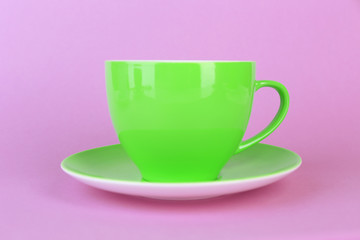 Colorful cup on color background