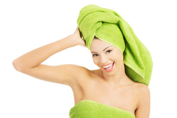 Portrait of beauty woman wrapped in towel