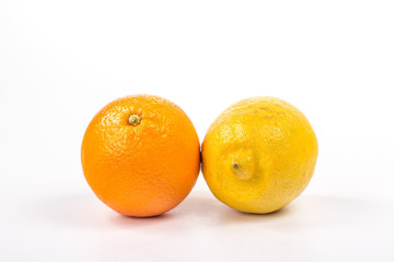 whole lemon and orange isolated on white background