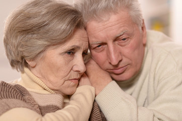 sad elder couple