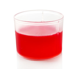 Cough syrup in cup isolated on white