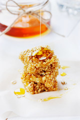 Muesli bar with honey on a white background