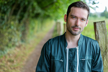 Portrait of a young attractive farmer in nature