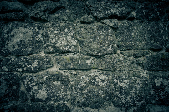 wall of natural stone with lichen