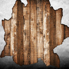 broken wall with wooden plank