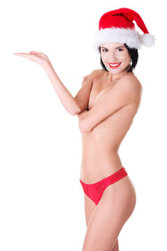 Woman with santa hat holding a copyspace
